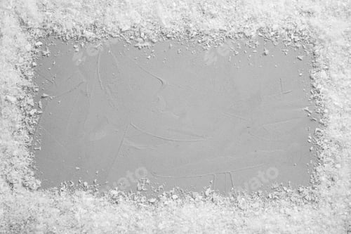 Preview: Frame of white snow on light grey stone background, top view with space for text. Christmas season