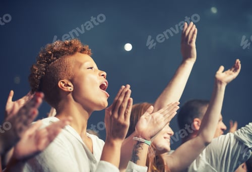 Preview: The most epic show of their lives. Young people getting into the music at an awesome concert.