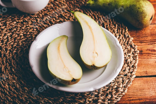 Preview: Halved Conference Pear on Plate
