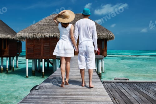 Preview: Couple On A Tropical Beach Jetty At Maldives