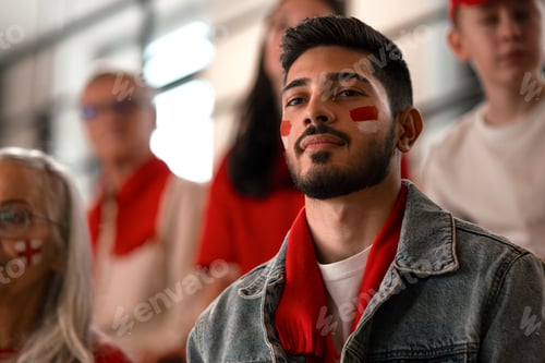 Preview: Excited football fans supproting Monaco national team in live soccer match at stadium.
