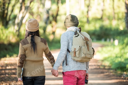 Preview: Young couple tourist travel in mountain forest
