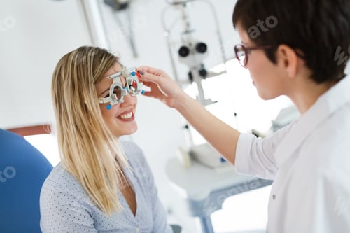 Preview: optometrist checking patient eyesight and vision correction