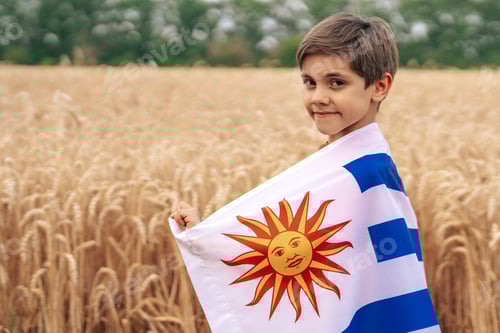 Preview: Smiling Child with Brown Hair in Wheat Field