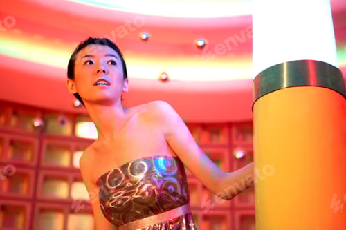 Preview: Woman Peeking Around Futuristic Lamp