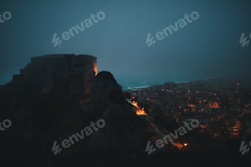 Preview: Castle of Carafa at night inside the fog. Roccella Jonica, Calabria Italy