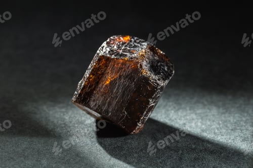 Preview: Brown Dravite Tourmaline Crystal Back Lit on Black