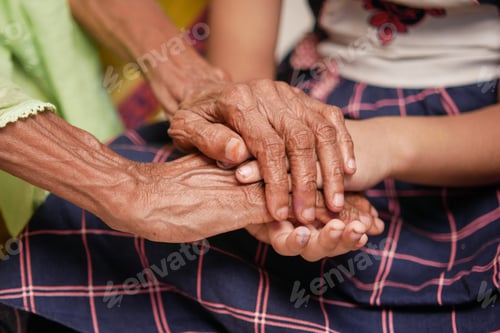 Preview: detail shot of child girl holding hand of a senior women