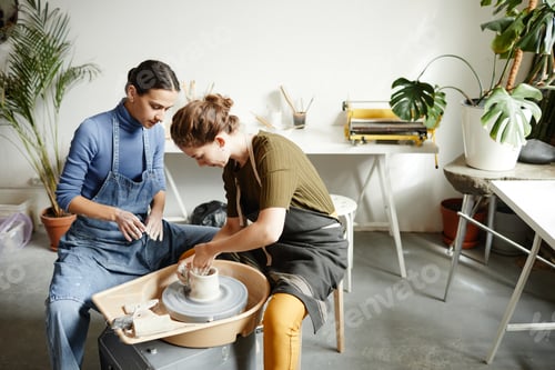 Preview: Female Artist Shaping Ceramics on Pottery Wheel