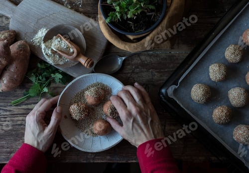 Preview: Person rolling in breadcrumbs sweet potatoes