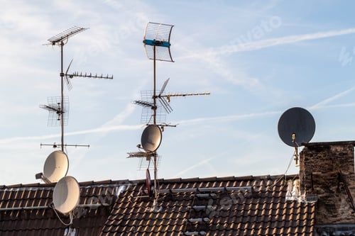 Preview: Old building roof with many different type receiver telecommunication antennas