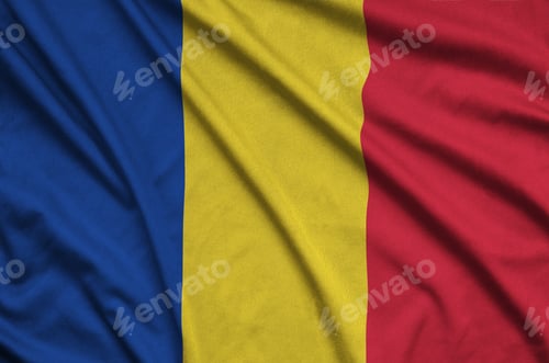 Preview: Romania flag is depicted on a sports cloth fabric with many folds. Sport team waving banner