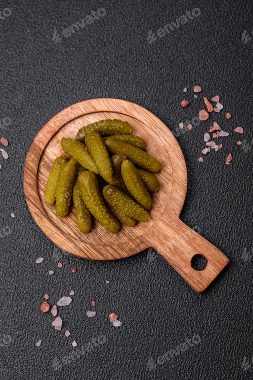 Preview: Delicious small pickled cucumbers gherkins with onions, mustard, salt and spices