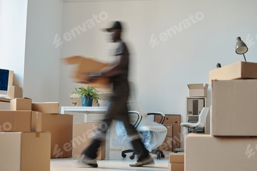 Preview: Worker carrying boxes during relocation