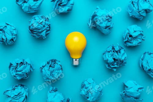 Preview: Great Idea Concept with Crumpled Office Paper and Light Bulb