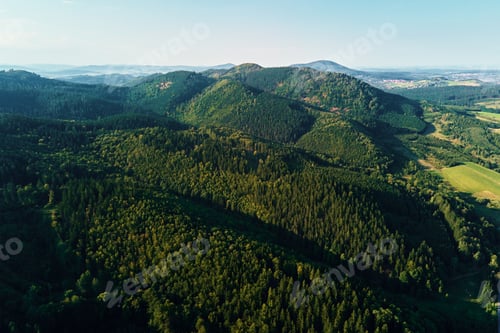 Preview: Mountains and green fields, aerial view. Panorama of beautiful landscape