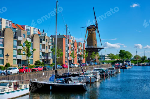 Preview: View of the harbour of Delfshaven and the old grain mill De Destilleerketel. Rotterdam, Netherlands