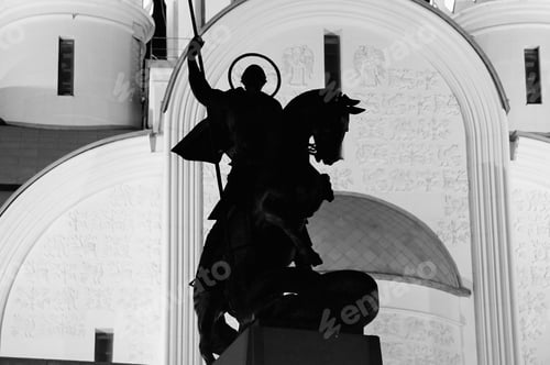 Preview: Silhouette of the monument to St. George the Victorious against the background of a large temple