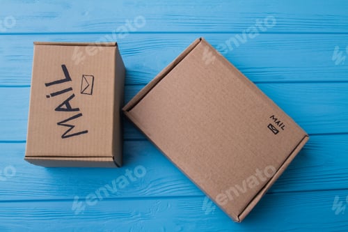 Preview: Two cardboard mail boxes, flat lay.