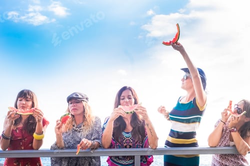 Preview: Cheerful young friends have fun and enjoy the summer