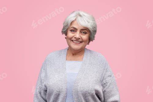 Preview: Friendly senior woman looking at camera