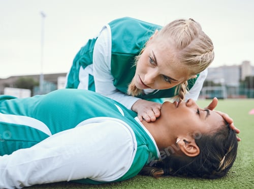 Preview: First aid, cpr and breathing with a hockey player on a field to save a player on her team after an