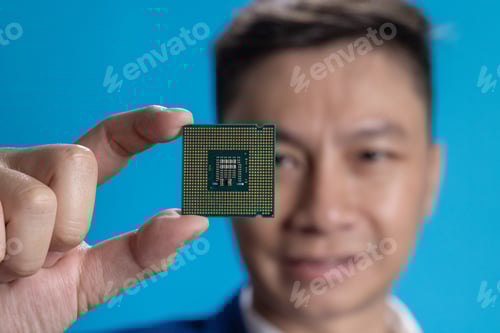 Preview: Businessman Holding Microchip Close-Up
