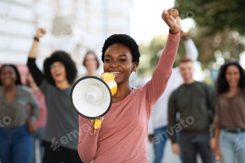Preview: Female leader of strikers with loudspeaker yelling demands to government