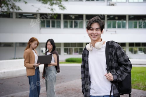 Preview: Diverse group of students smiling and studying on a university campus