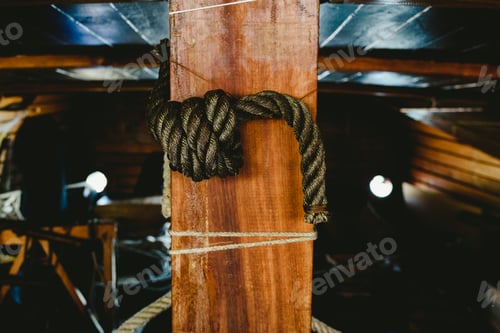 Preview: Close-Up of Rope Knot on Wooden Post