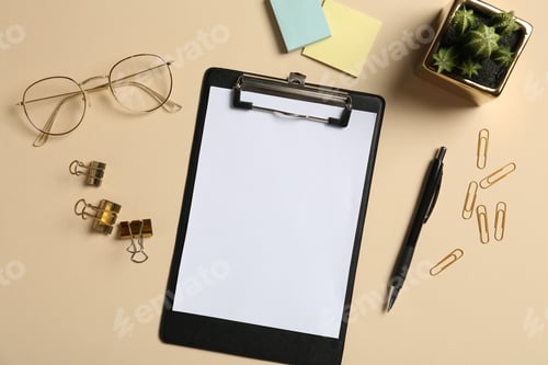 Preview: Flat lay composition with clipboard and blank paper on beige background. Space for text