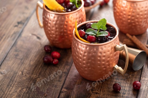 Preview: Cranberry orange moscow mule cocktail in copper mugs