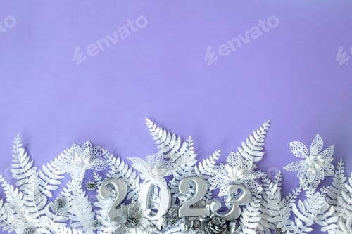Preview: Lilac Christmas background with numbers 2023, flat lay.