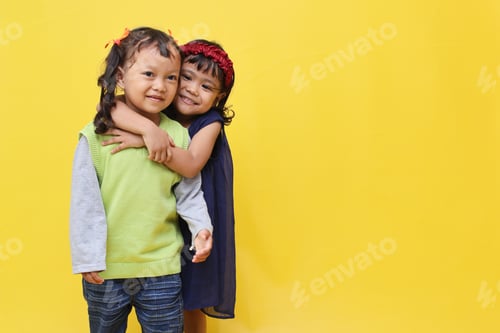 Preview: Cute little Asian girls hugging her friend