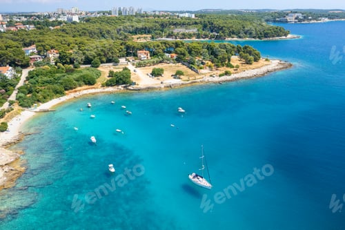 Preview: Aerial view of sailboat and small boats or yachts in the turquoise waters of the Adriatic sea close