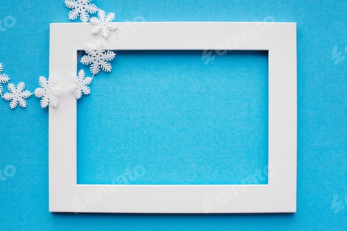 Preview: White frame and snowflakes on a blue background. New year, holiday, decoration.