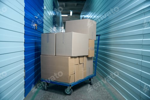 Preview: Cardboard boxes stuffed with things on a cart