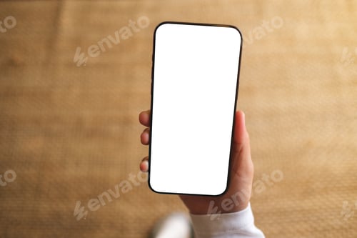 Preview: Top view mockup image of a woman holding mobile phone with blank desktop white screen