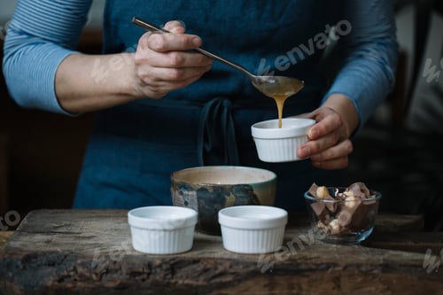Preview: Woman preparing dessert, partial view