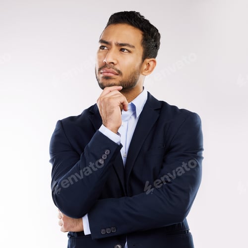 Preview: Studio shot of a young businessman looking thoughtful against a white background