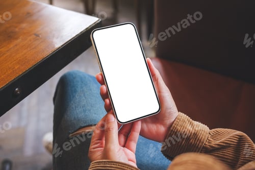 Preview: Mockup image of a woman holding mobile phone with blank desktop screen in cafe