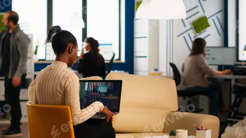 Preview: Black woman discussing with remote disabled colleague using video call