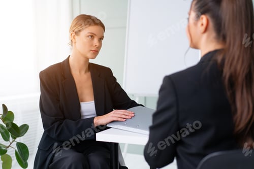 Preview: Job interview , Business, career and placement concept. Young blonde woman holding resume