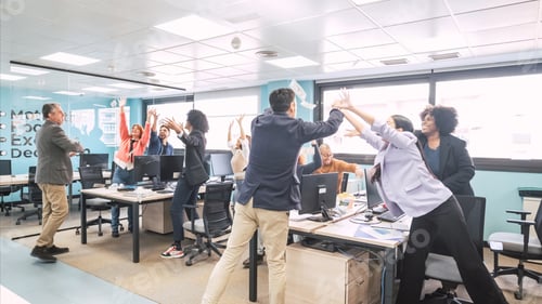 Preview: Happy businesspeople reaching for paper notes thrown by managers at office