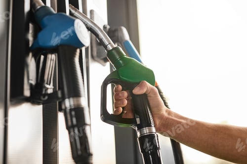 Preview: Crop man taking fuel pump nozzle at gas station