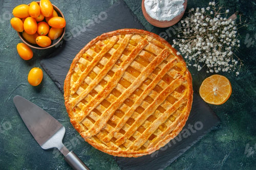 Preview: top view yummy kumquats pie on a dark-blue background bake dessert color tea sweet biscuit dough