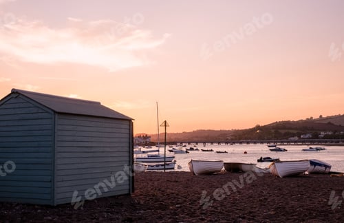 Preview: Landscape of colorful cabins on the beach in Teignmouth, Devon, England