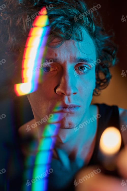 Moody Young Adult with Rainbow Light Reflection