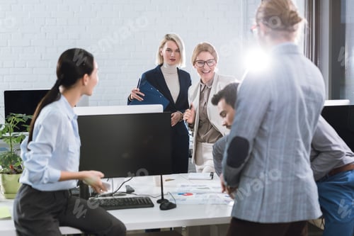 Preview: selective focus of business team discussing business project at work in office