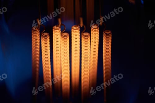 Preview: Electric vintage Edison light bulb with a spiral on a blue background. Retro style lamp
